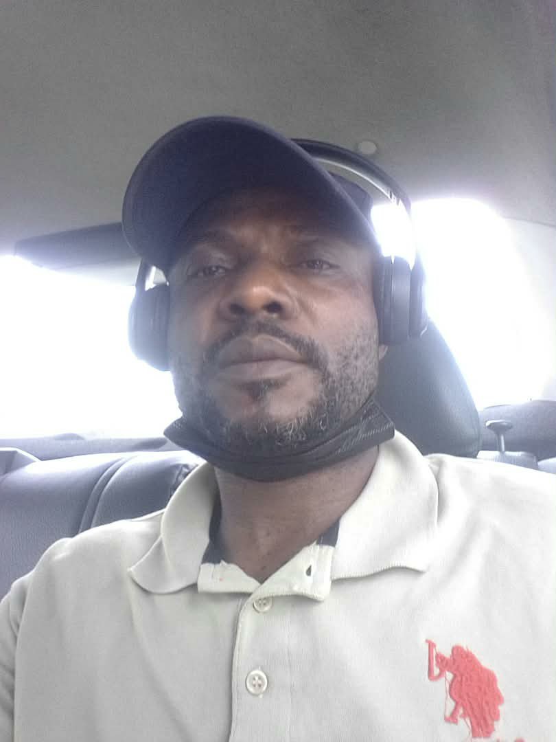 In a car, headphones