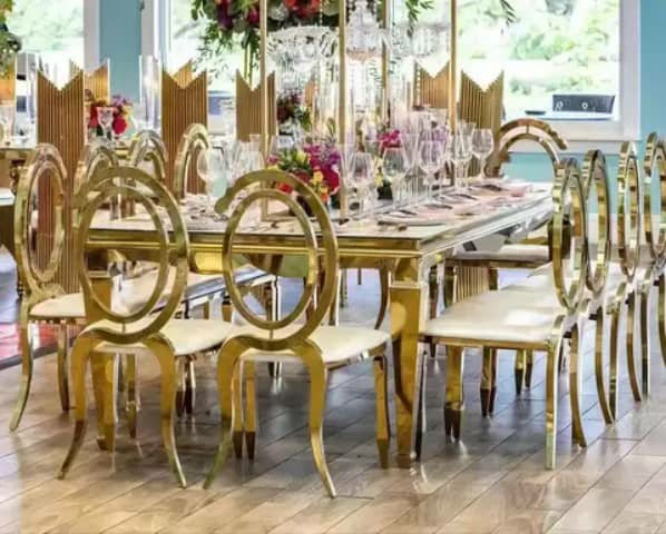 Gold banquet table with round-back chairs