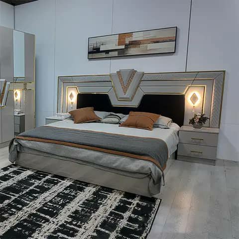 Grey bedroom set with bed, nightstands and wardrobe