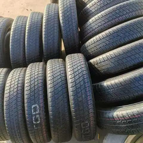 Rows of car tyres stacked outdoors