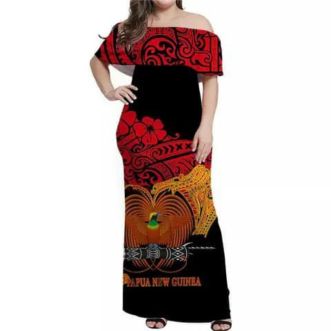 A woman wearing a long off-shoulder dress with a red and black Papua New Guinea print.