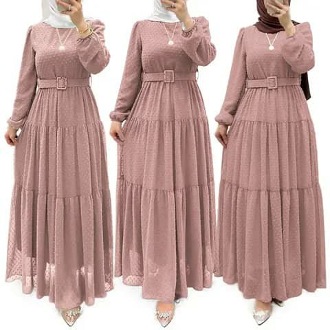 Three women wearing dusty-pink tiered maxi dresses with belts.