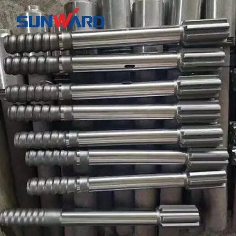 Seven silver drill rods stacked in a row.
