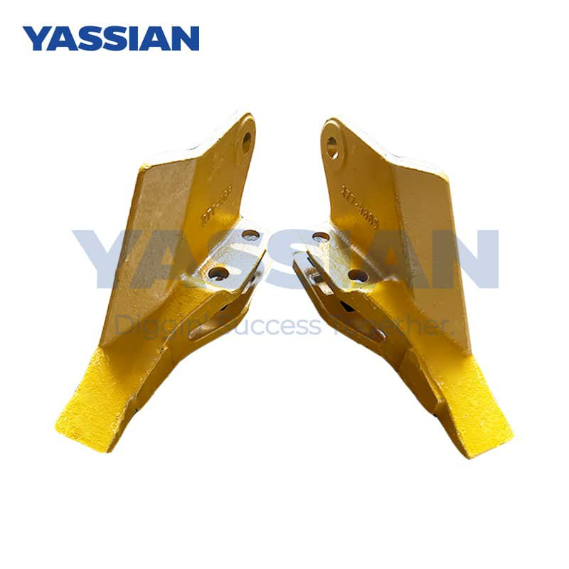 Two yellow excavator bucket teeth side by side.