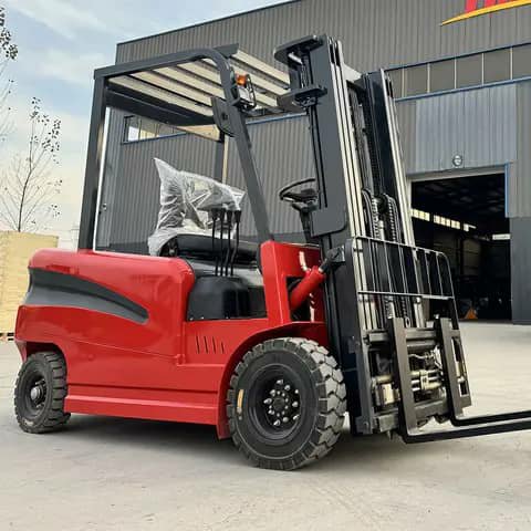 Red forklift with cage parked outdoors