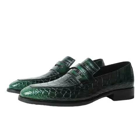 Green penny loafers with a croc pattern.