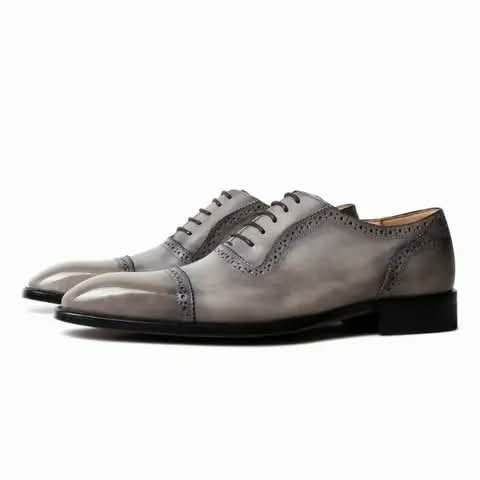 Grey brogue Oxford shoes.