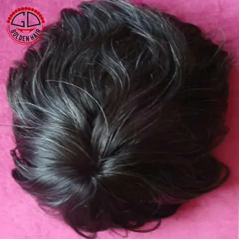 A black wavy hair topper on a pink background with a Golden Hair logo in the corner.
