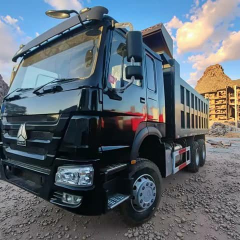 Black HOWO dump truck on a site