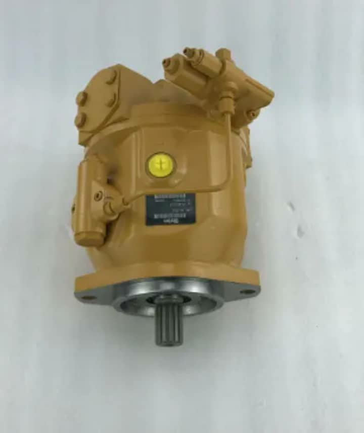 A tan hydraulic pump with a yellow cap and shaft pointing down, on a white background.