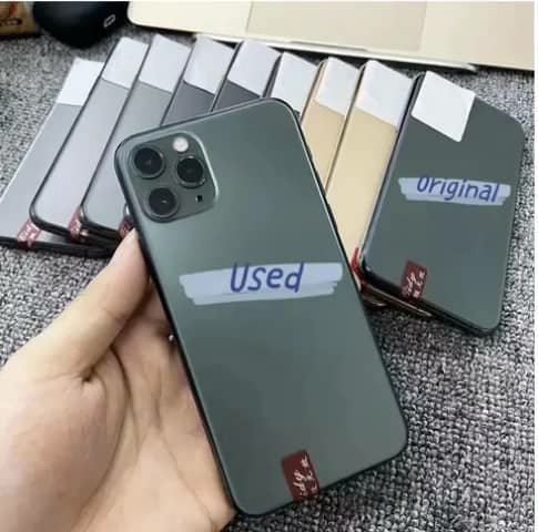 Used iPhone in dark green, triple camera