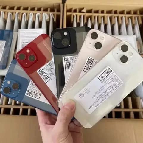 Five iPhones held up in blue, red, black, pink and white