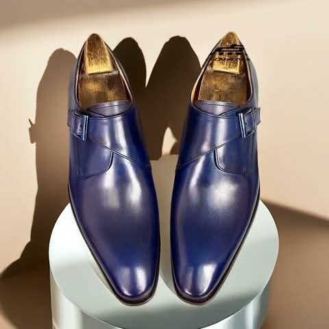 Navy monk strap shoes seen from above.