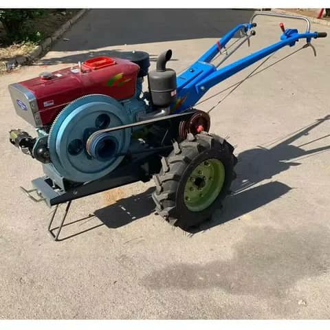 Two-wheel power tiller, red engine and blue frame, outdoors