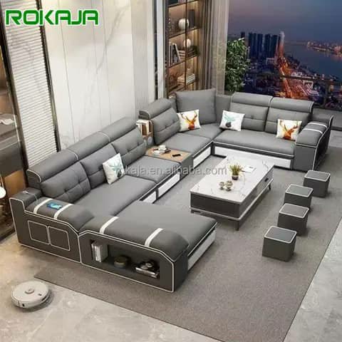 Grey sectional sofa with coffee table and stools
