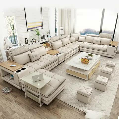 White sectional sofa with ottomans and coffee table
