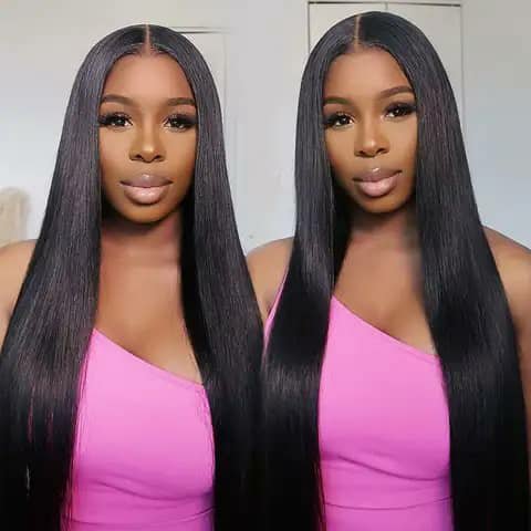 Two women wearing very long straight black wigs.