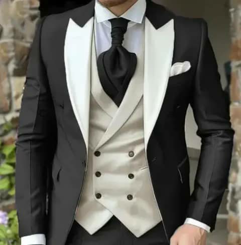 Black suit with ivory vest and black tie