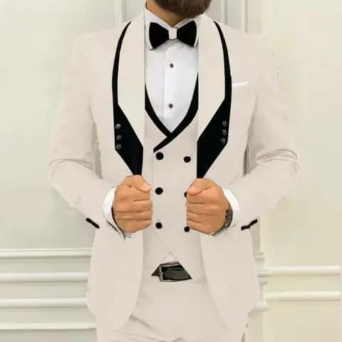 Ivory suit with black lapels and bow tie