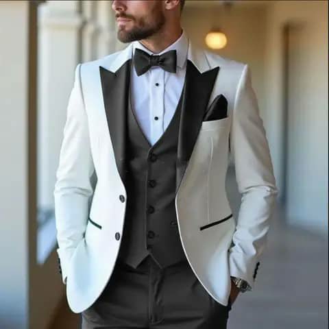 White suit with black vest, trousers and bow tie