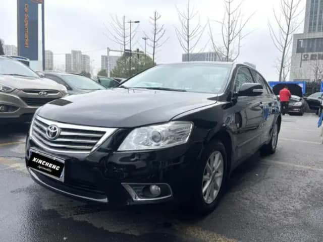Black Toyota Camry sedan in a lot