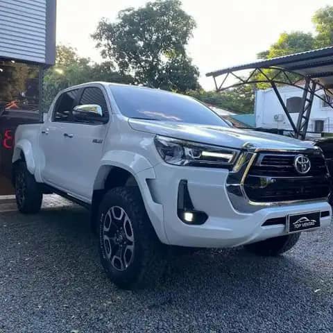 White Toyota Hilux pickup parked outdoors