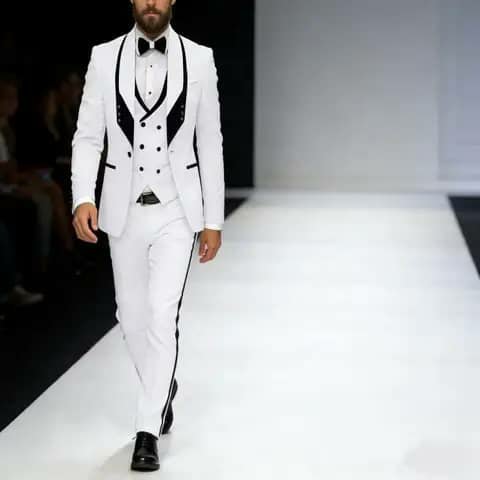 White tuxedo suit with black trim and bow tie