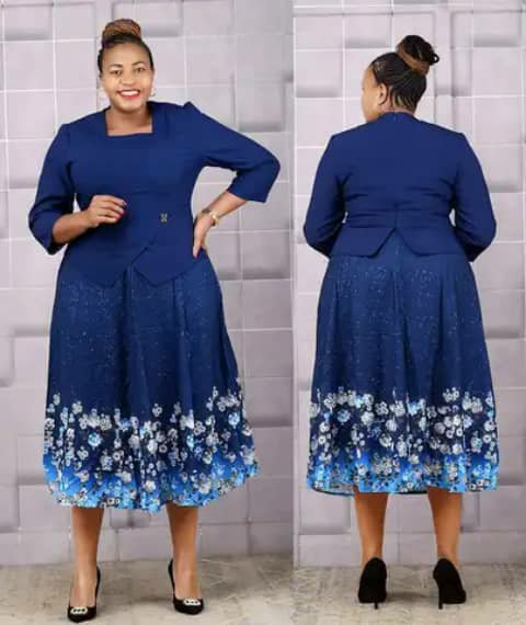 A woman wearing a navy two-piece set with a peplum jacket and a skirt with a floral hem, front and back views.