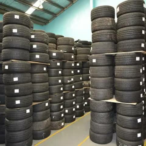 Shelves of tyres in a warehouse