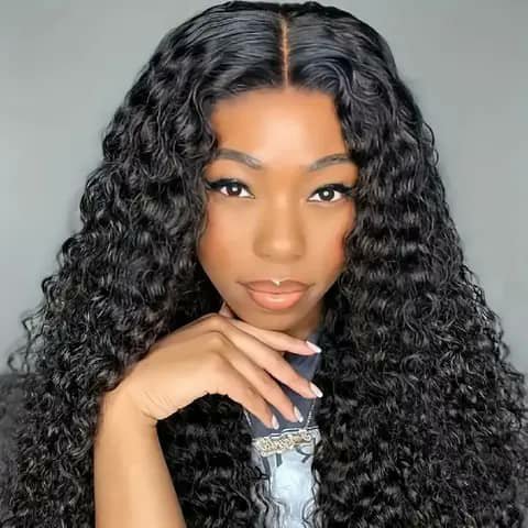 A woman wearing a long curly black wig.