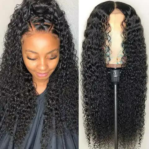 Two views of a long dark curly wig, worn by a woman and on a mannequin head.