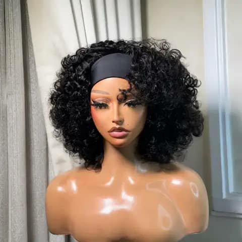 A mannequin head wearing a short black curly wig with a headband.