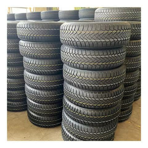 Stacks of winter tyres in a warehouse